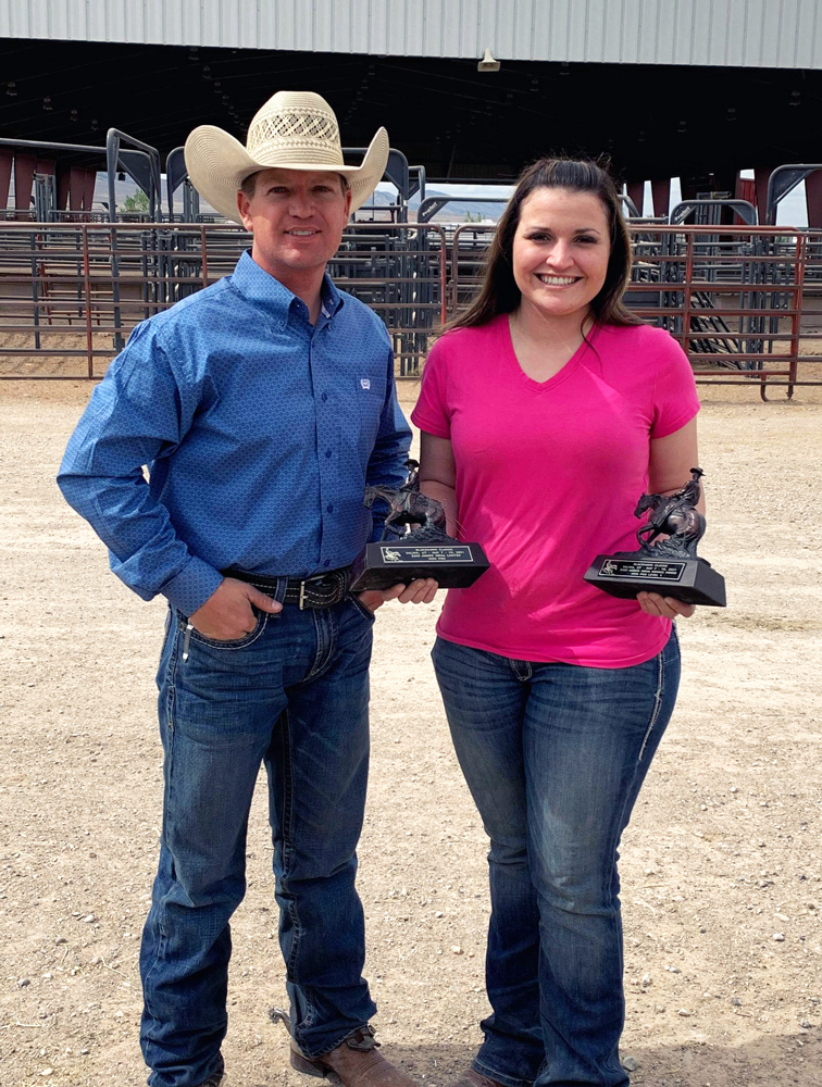 reining horse trainer, Preston Kent, and client, Taylor Anderson, with trophies at a horse show